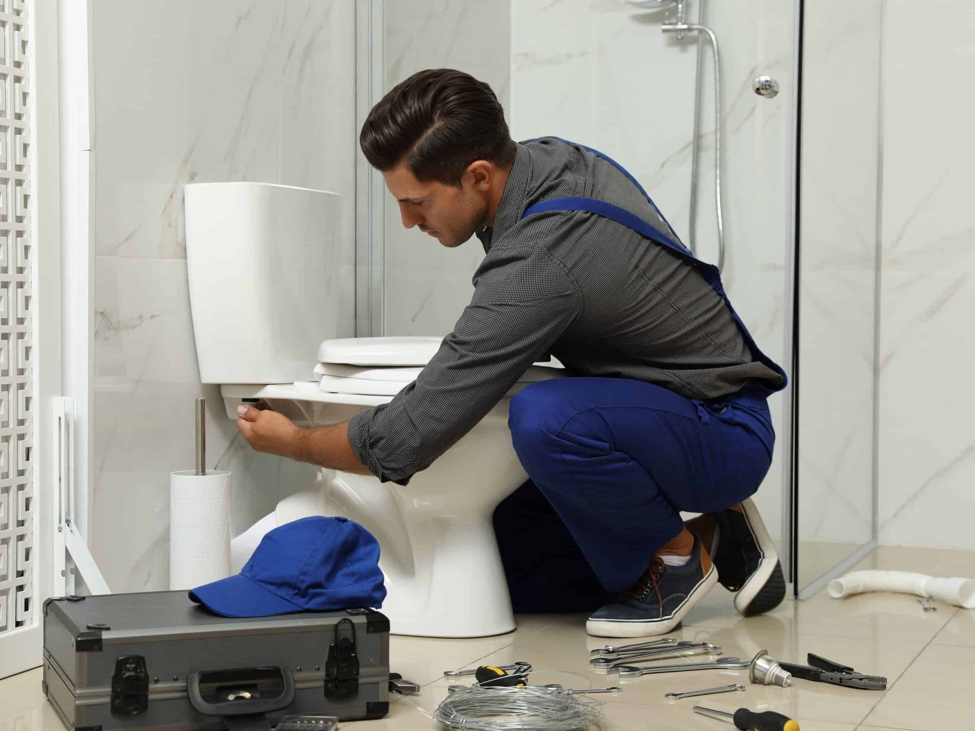 Plumber Fixing Toilet