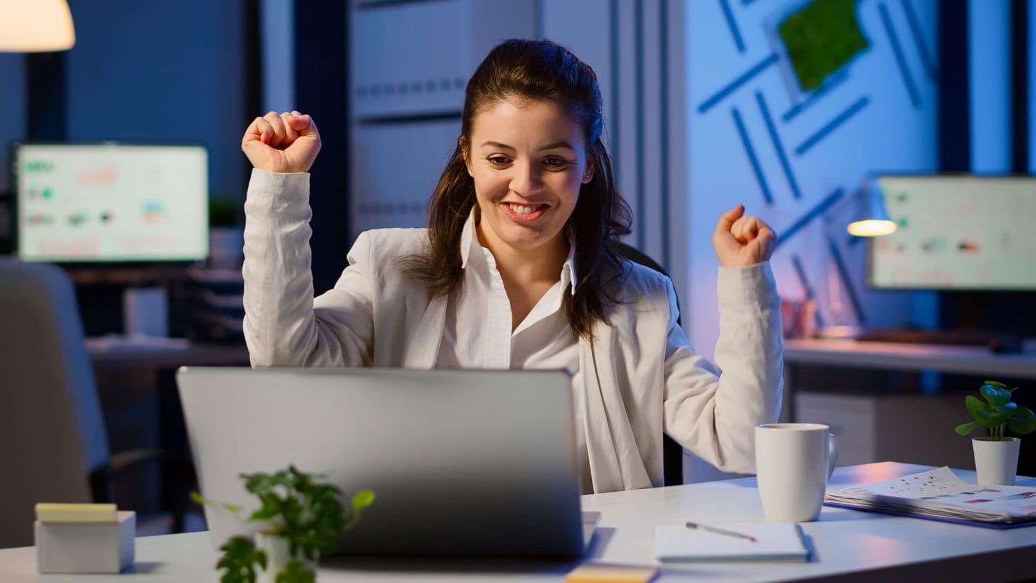 happy-employee-with-hands-in-air-smile-on-face